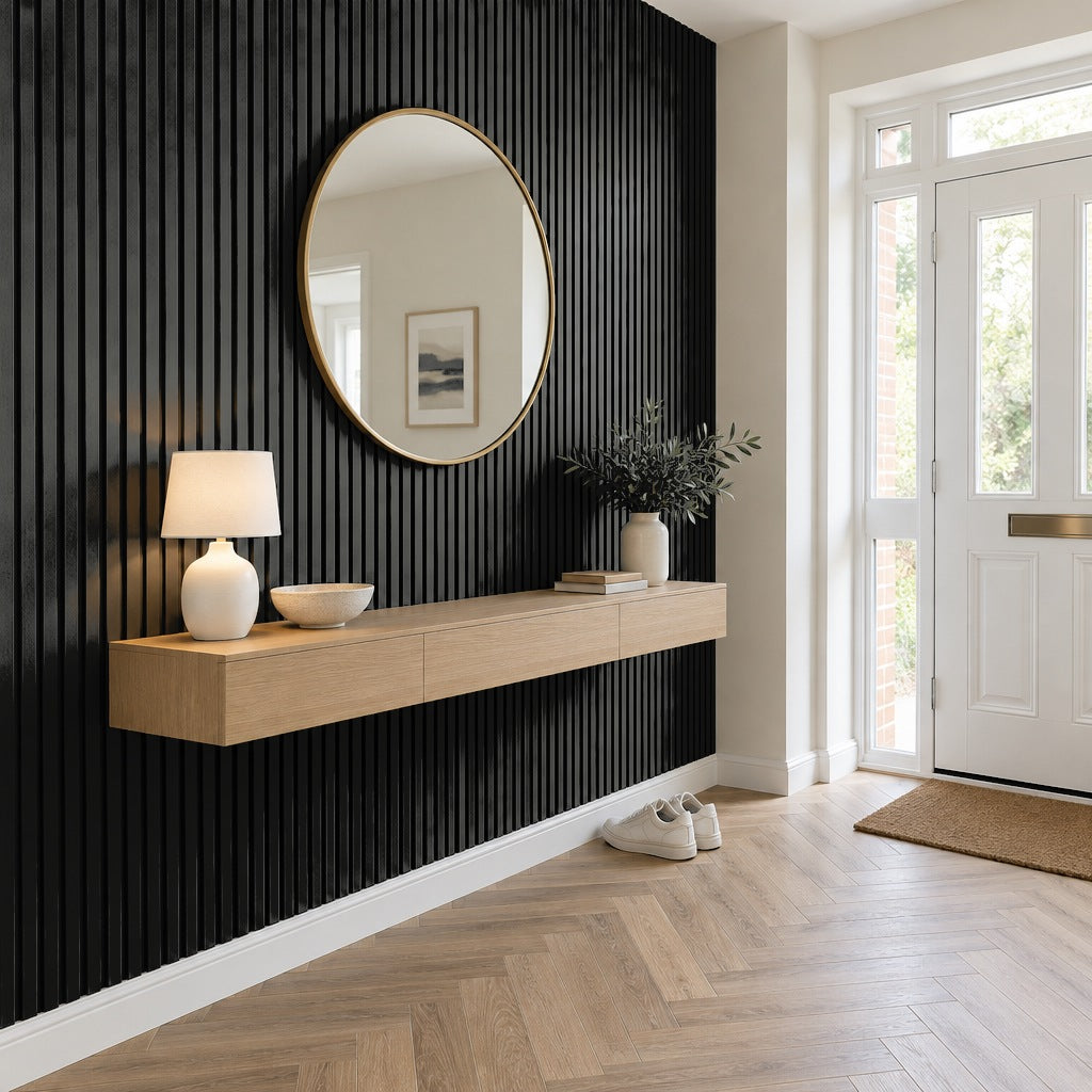 Black slat wall panels on a hallway feature wall with a floating oak console