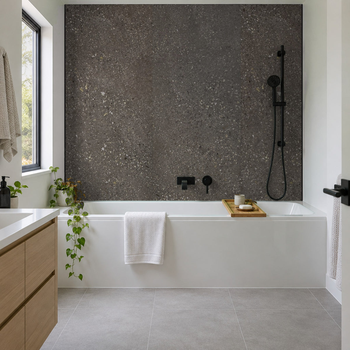 Pewter Rapid Stone waterproof panels on the wall above a bath with shower