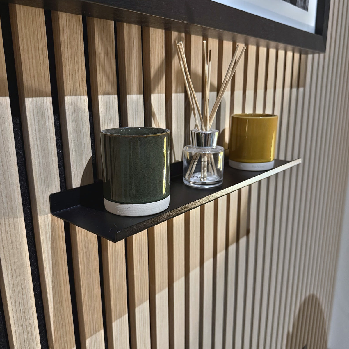 Slat wall shelf from an angle showing the front lip