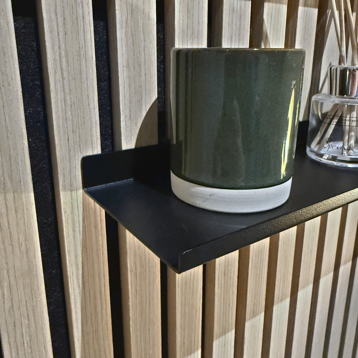 Close-up of the folded steel edge and matt black finish